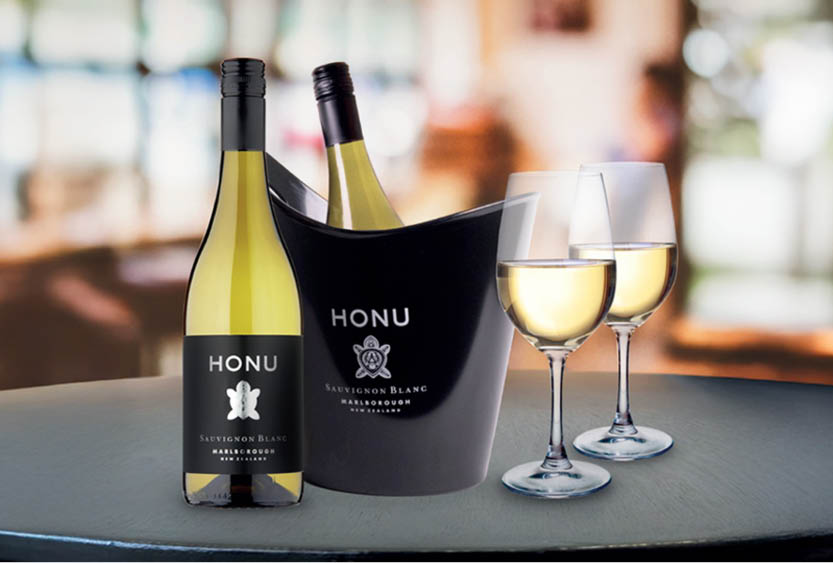 Bottle of Honu with glasses of white wine