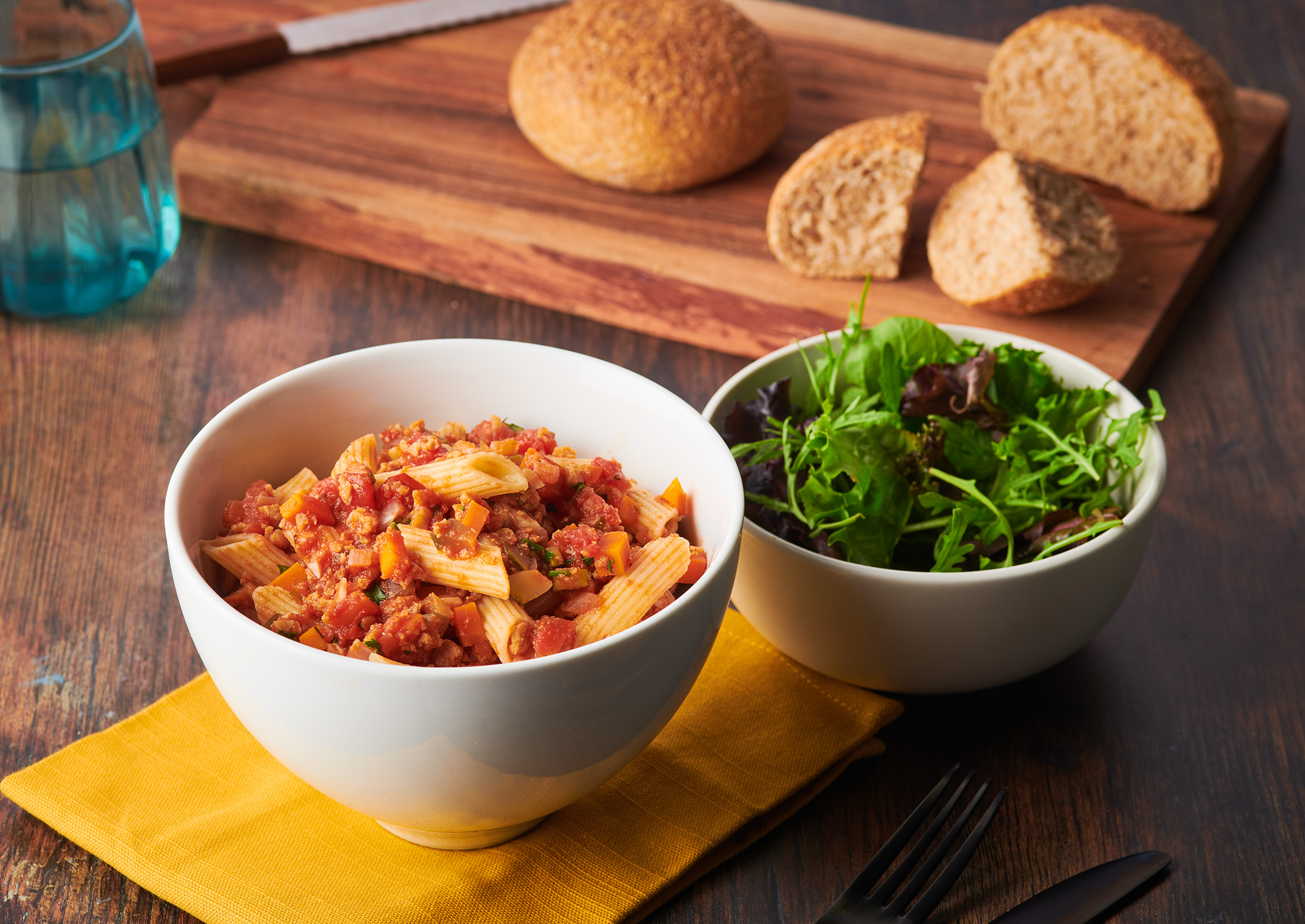 Bolognese with salad and fresh bread