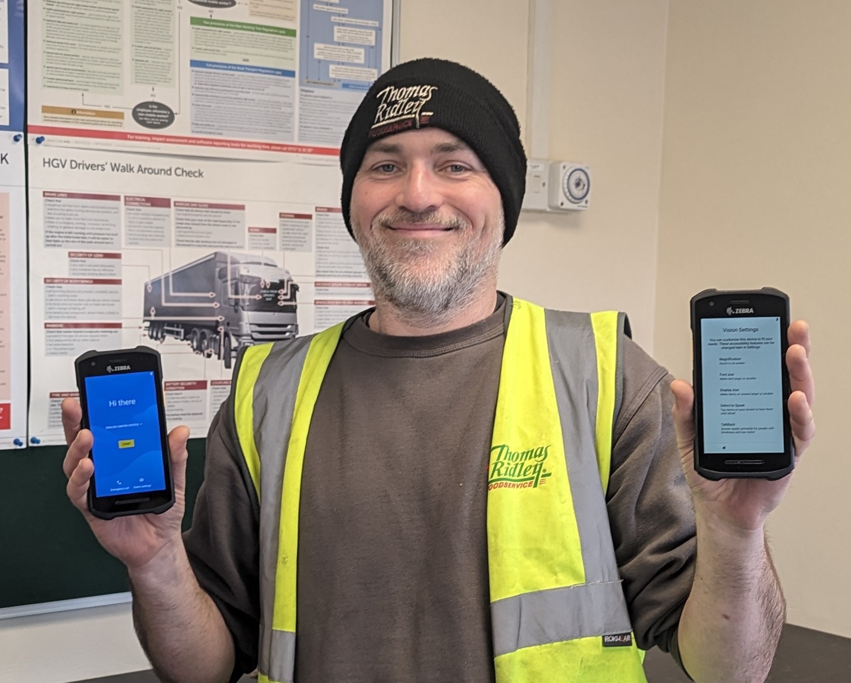 Image of Rob Poulton showing the new podfather system on two mobile phones