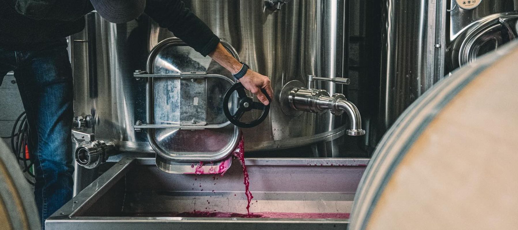 Flint Vineyard red wine being poured from a tank